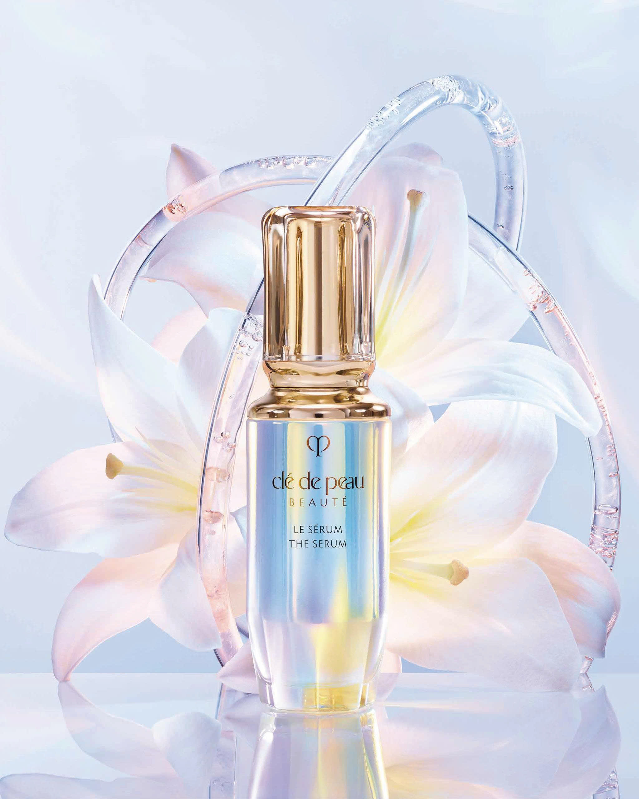 serum - chai serum màu hologram với nắp mạ vàng của thương hiệu Cle De Peau Beaute